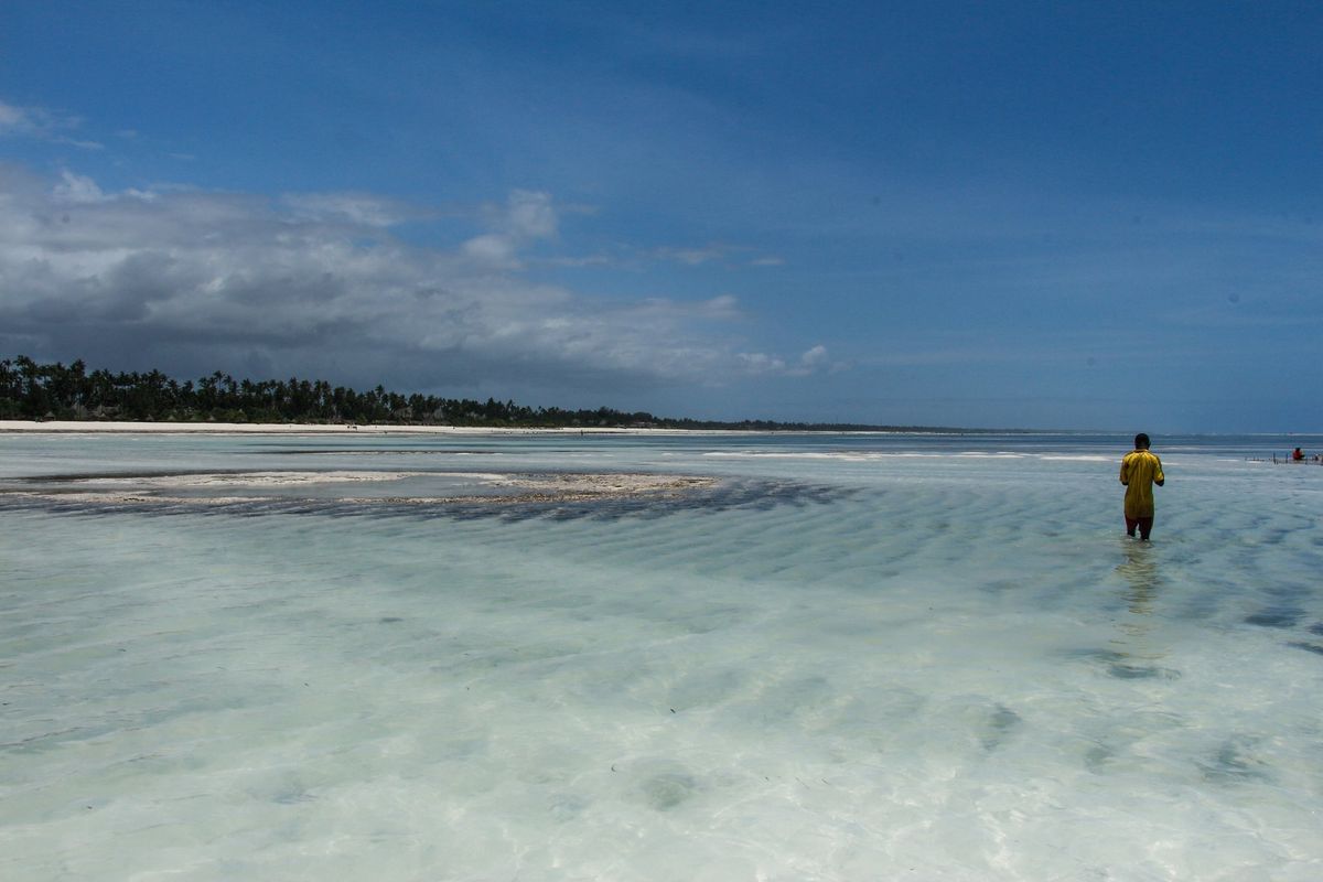 Clear turquoise water and white sand on a Zanzibar beach